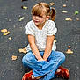 child, girl, sitting, autumn, leaves, asphalt, casual_clothing, pony_tail, blue_jeans, brown_shoes, outdoor, daylight, portrait, cross_legged, young_person, nature, fall, pavement, thoughtful, casual