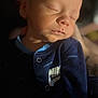 Dakota joined the competition — help win amazing prizes! baby, newborn, sleeping, face, clothing, onesie, nike, infant, portrait, closeup, peaceful, soft_light, dark_background, human, skin, cute, child, young, resting, indoors