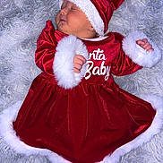 Lottie-Rae joined the competition — help win amazing prizes! baby, sleeping, christmas, santa_hat, red_dress, fur_trim, cozy, blanket, infant, holiday, cute, festive, child, portrait, soft, peaceful, indoors, holiday_clothing, newborn, resting