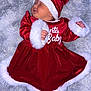 baby, sleeping, christmas, santa_hat, red_dress, fur_trim, cozy, blanket, infant, holiday, cute, festive, child, portrait, soft, peaceful, indoors, holiday_clothing, newborn, resting