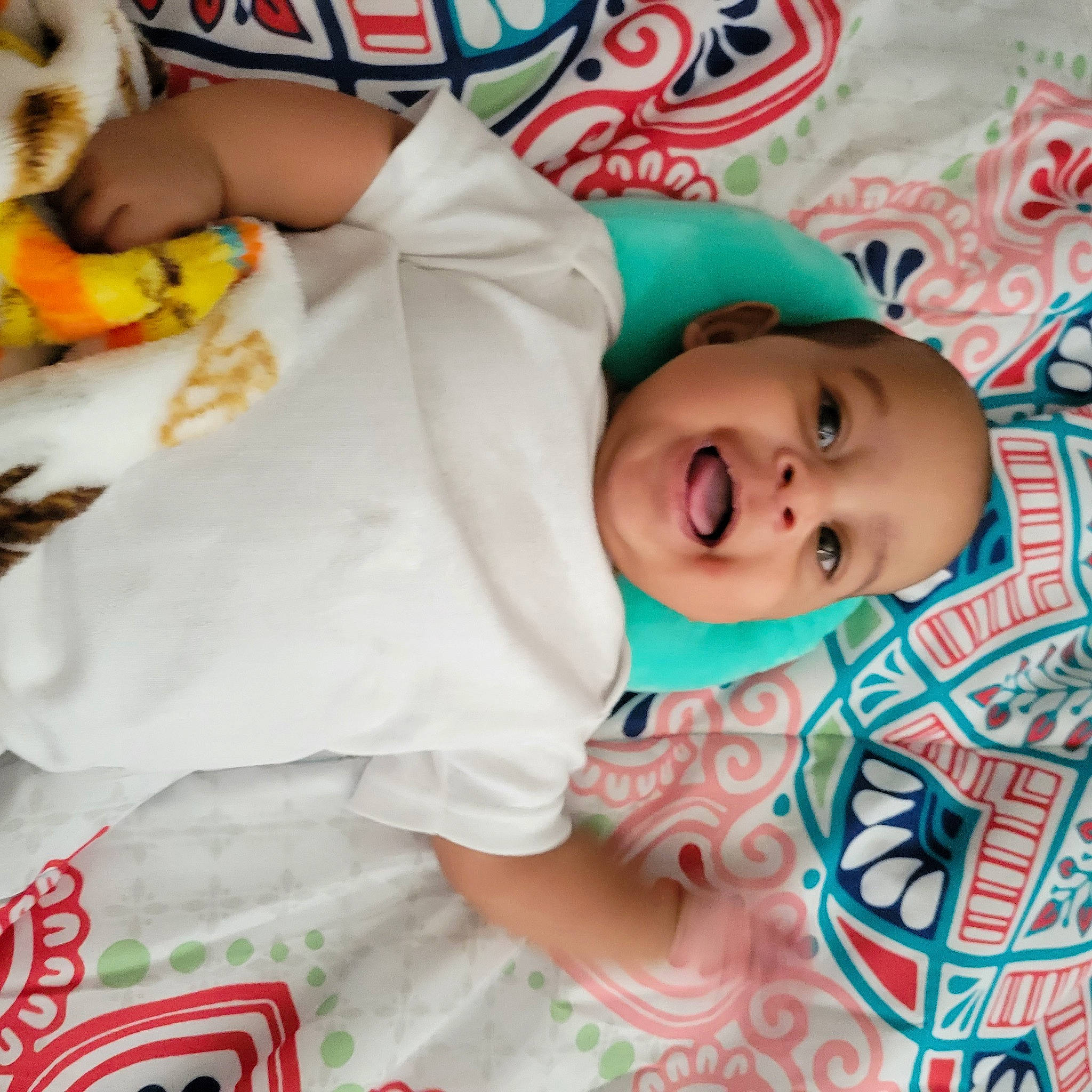 Jream is registered to the contest to win money with this photo: arm, baby, baby_products, baby_safety, baby_toddler_clothing, bedding, bedtime, cheek, child, comfort, happy, linens, mouth, pattern, person, room, skin, sleeve, smile, toddler