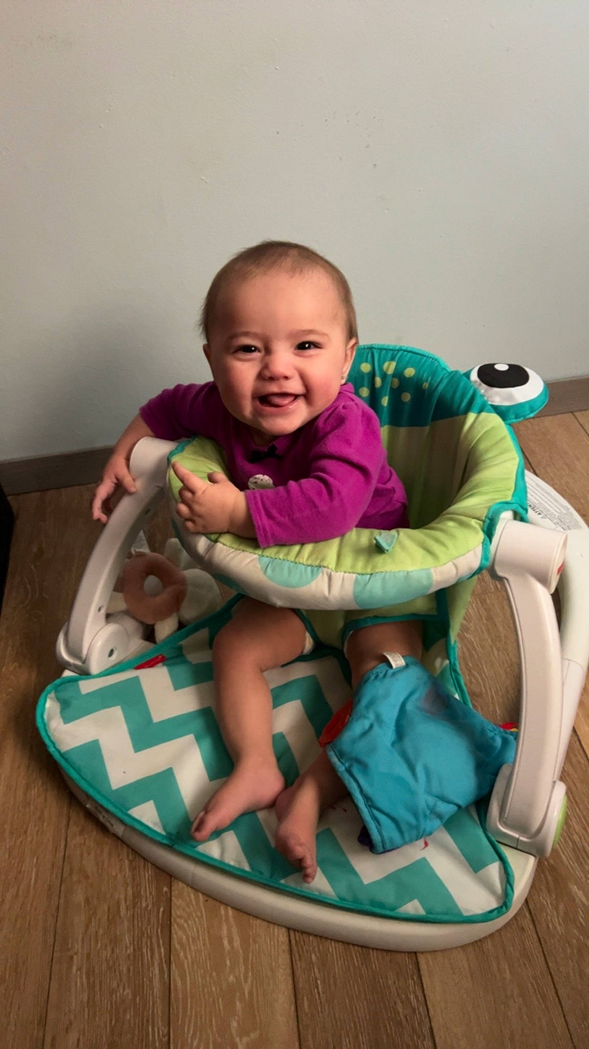 Alanna joined the competition — help win amazing prizes! baby, baby_products, baby_toddler_clothing, baby_toys, chair, child, comfort, flooring, fun, happy, joy, lap, leg, leisure, person, personal_protective_equipment, play, sitting, smile, sock