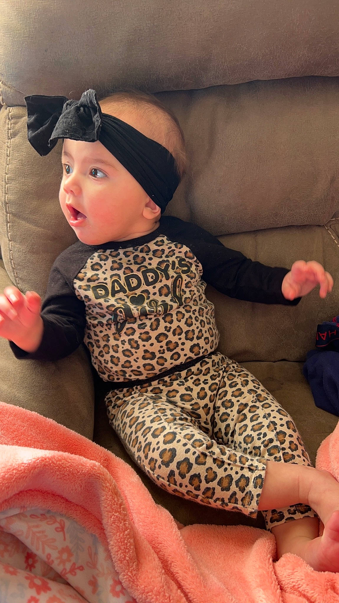 Alanna joined the competition — help win amazing prizes! baby, baby_toddler_clothing, cap, child, comfort, finger, hand, headwear, human_body, human_leg, knee, lap, leg, neck, pattern, person, sitting, skin, sleeve, sock