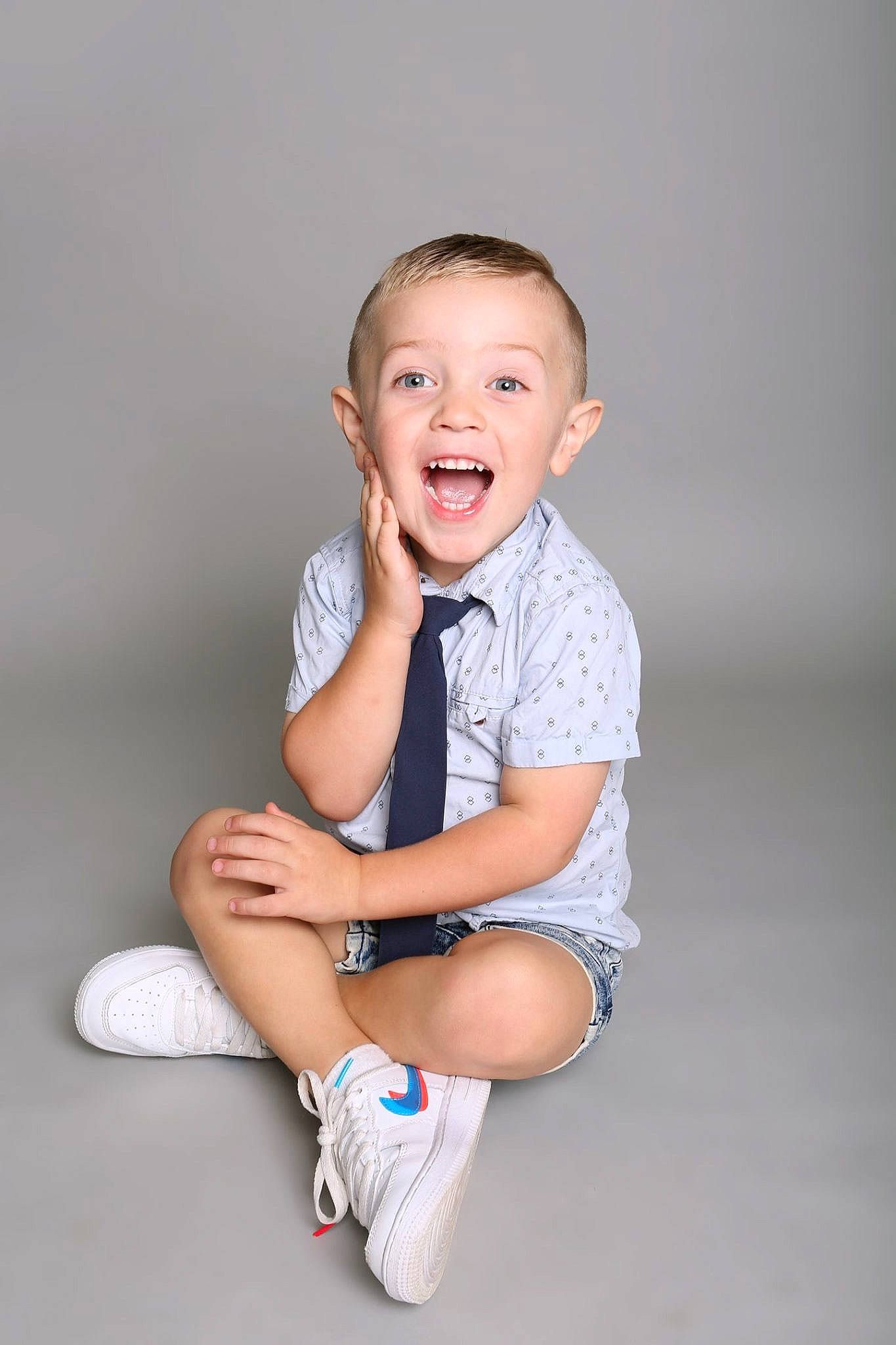 Nixon joined the competition — help win amazing prizes! baby, blue, cheek, child, child_model, facial_expression, fun, happy, laugh, leg, person, photo_shoot, photography, portrait, portrait_photography, sitting, skin, smile, standing, toddler