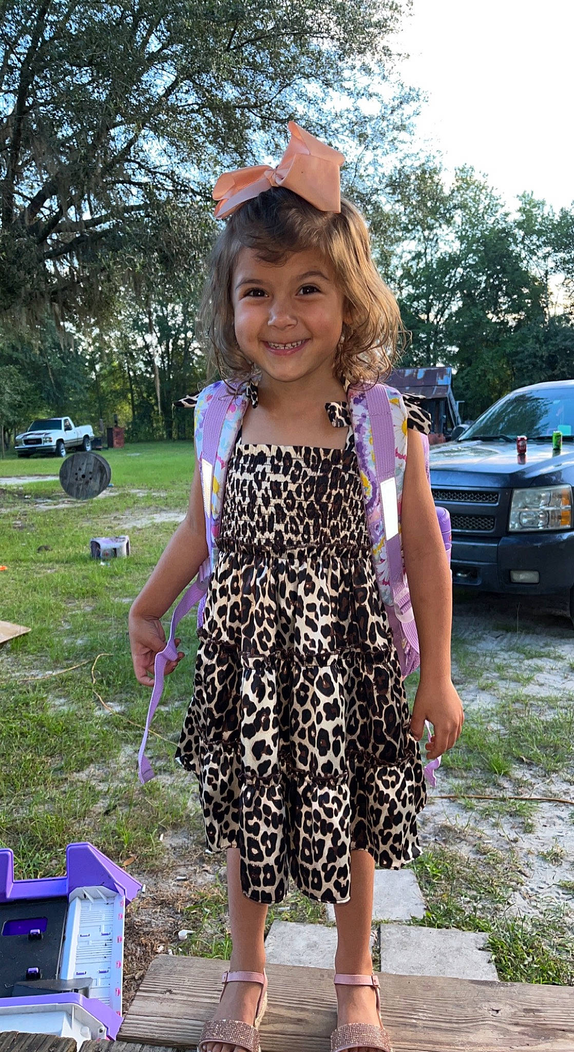 Kamryn is registered to the contest to win money with this photo: baseball_cap, cap, car, child, dress, electric_blue, event, fun, grass, hat, joy, leisure, person, pink, plant, recreation, smile, summer, sun_hat, tire