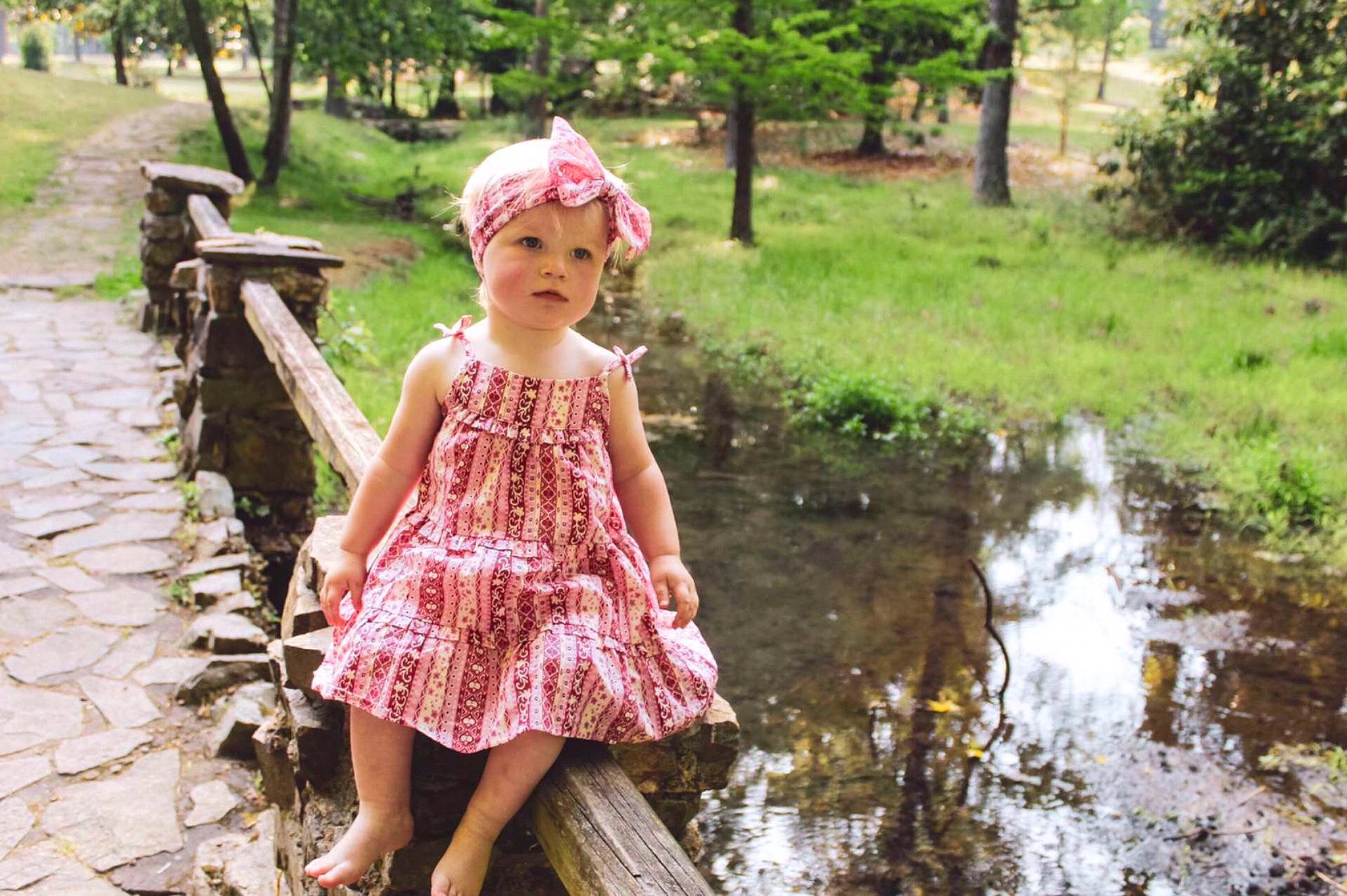 Heather joined the competition — help win amazing prizes! child, dress, fun, garden, grass, grass_family, green, happy, headwear, landscape, leisure, magenta, natural_landscape, pattern, people_in_nature, person, plant, recreation, sitting, sunlight