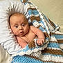 baby, infant, blanket, crochet, blue, white, brown, pillow, soft, wrapped, cute, wide_eyes, skin, hand, expression, indoor, portrait, child, newborn, person