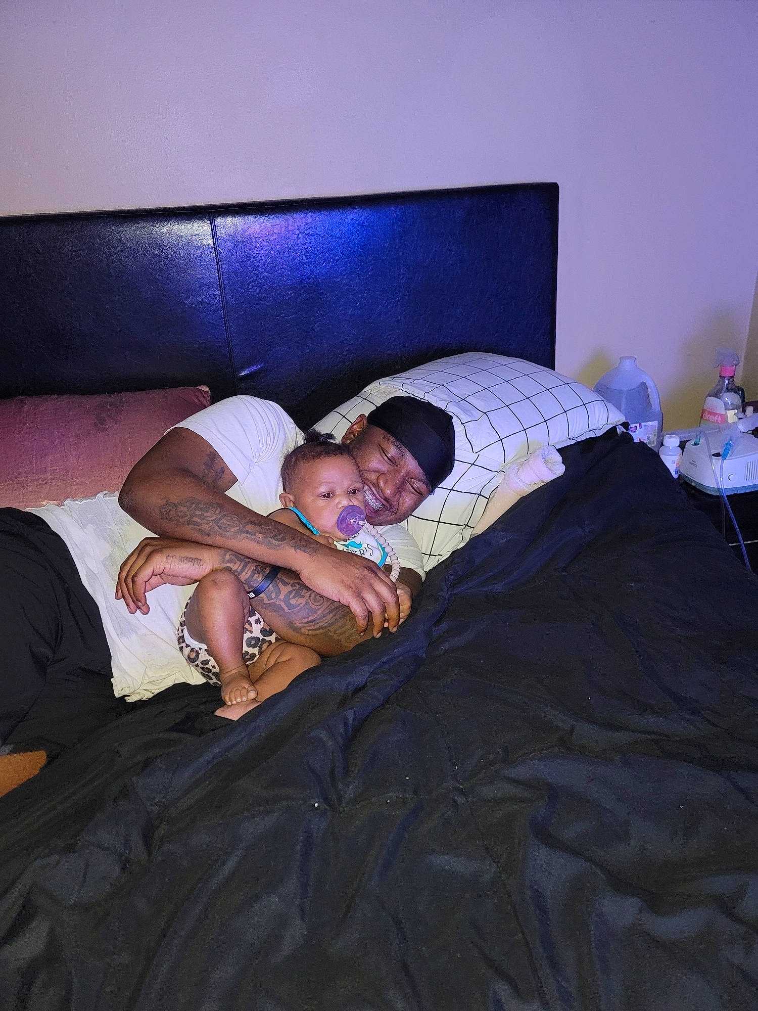 Heaven is registered to the contest to win money with this photo: barefoot, bed, bed_sheet, bedding, bedroom, comfort, elbow, flooring, foot, fun, headwear, human_leg, joy, knee, linens, person, room, shorts, sitting, thigh