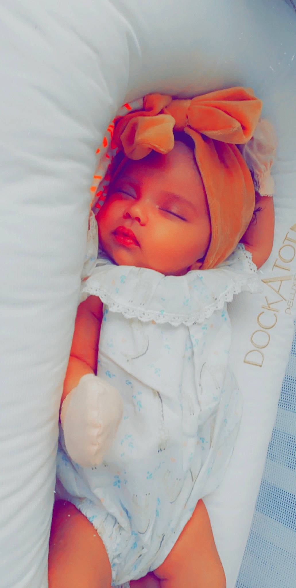 Nova is registered to the contest to win money with this photo: baby, baby_sleeping, cheek, child, doll, headwear, orange, person, pink, skin, sleep, toddler