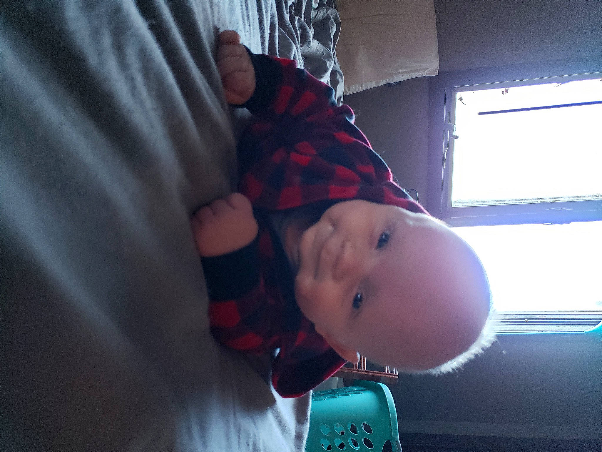 Paul is registered to the contest to win money with this photo: automotive_lighting, baby, baby_toddler_clothing, child, cloud, darkness, elbow, electric_blue, finger, flesh, fun, hat, magenta, pattern, person, plaid, room, sleeve, tartan, toddler