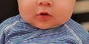 Alexis a rejoint le concours — aidez-le/la à gagner de superbes lots ! baby, child, infant, face, blue_striped_clothing, onesie, hand, portrait, closeup, curious, young, cute, soft_lighting, tousled_hair, skin, flesh, sitting, indoor, expression, looking