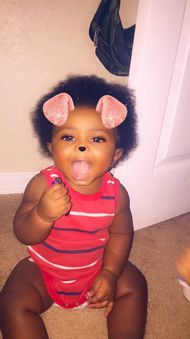 Kevron is registered to the contest to win money with this photo: abdomen, baby, cheek, child, ear, face, fun, head, lip, neck, nose, organ, person, pink, skin, smile, toddler