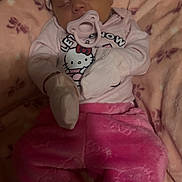 Iris is registered to the contest to win money with this photo: baby, sleeping, pink_clothing, mittens, knitted_hat, blanket, hello_kitty, pacifier, infant, cozy, cute, child, soft_texture, floral_pattern, indoor, portrait, resting, warm, toddler, sleep