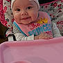 Cheyenne is registered to the contest to win money with this photo: baby, baby_accessory, bib, black, child, clothing, cute, face, happy, headband, high_chair, indoor, infant, person, pink, portrait, seat, smile, toy, white