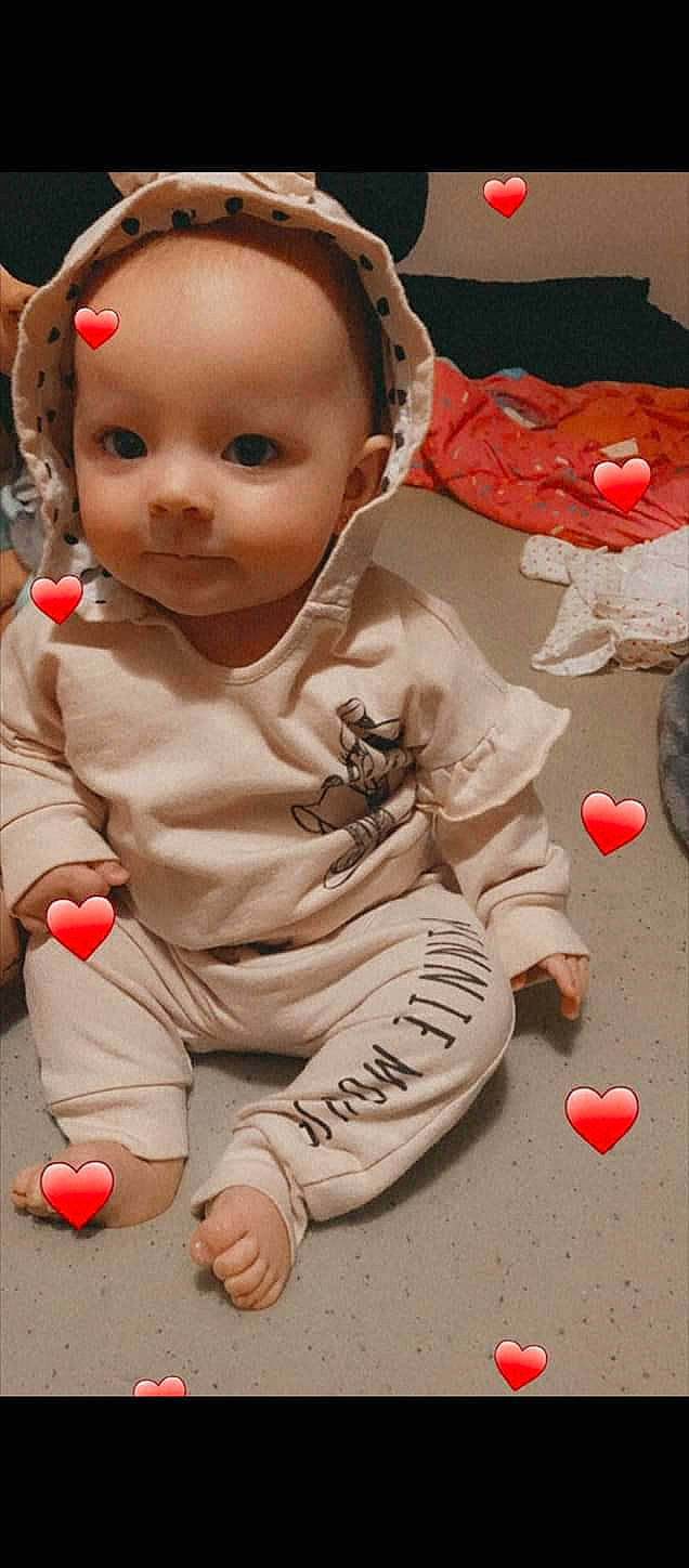 Sakara Jade is registered to the contest to win money with this photo: baby, baby_toddler_clothing, carmine, cheek, child, facial_expression, flooring, font, fun, happy, organ, people, person, pink, play, red, skin, toddler, toy, white