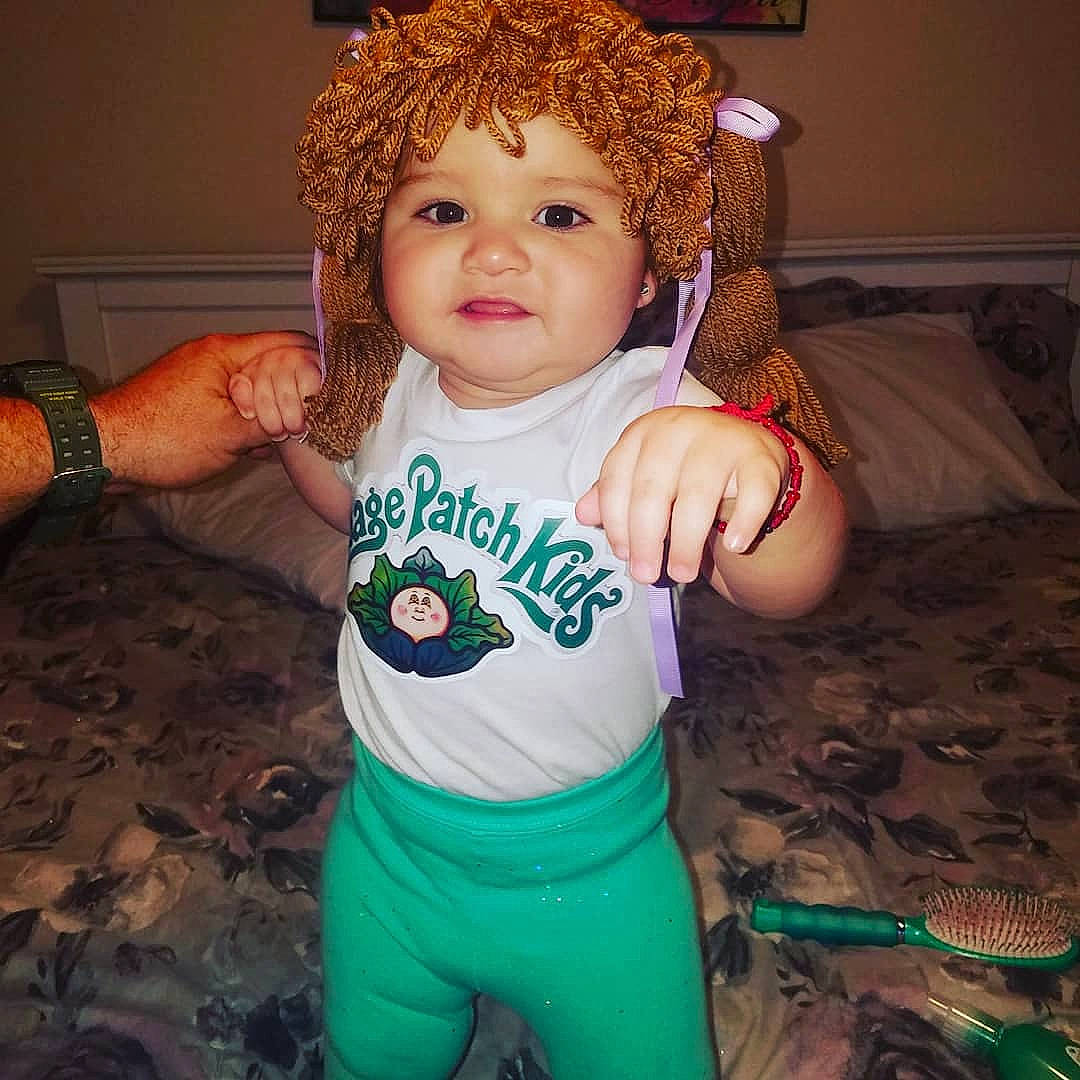 Pandora is registered to the contest to win money with this photo: arm, baby_toddler_clothing, brown_hair, cheek, child, cool, costume, eye, fictional_character, hair, happy, head, person, red_hair, sleeve, smile, t_shirt, toddler