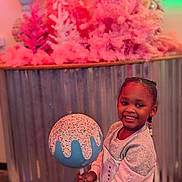 Coirey joined the competition — help win amazing prizes! child, girl, smile, lollipop, sprinkles, candy, braids, beads, sweater, portrait, indoor, decor, pink_trees, corrugated_metal, background, holding, happy, colorful, playful, props