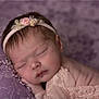 newborn, baby, sleeping, headband, floral, lace, purple, blanket, soft, peaceful, closeup, infant, cute, resting, portrait, delicate, skin, face, hand, cozy