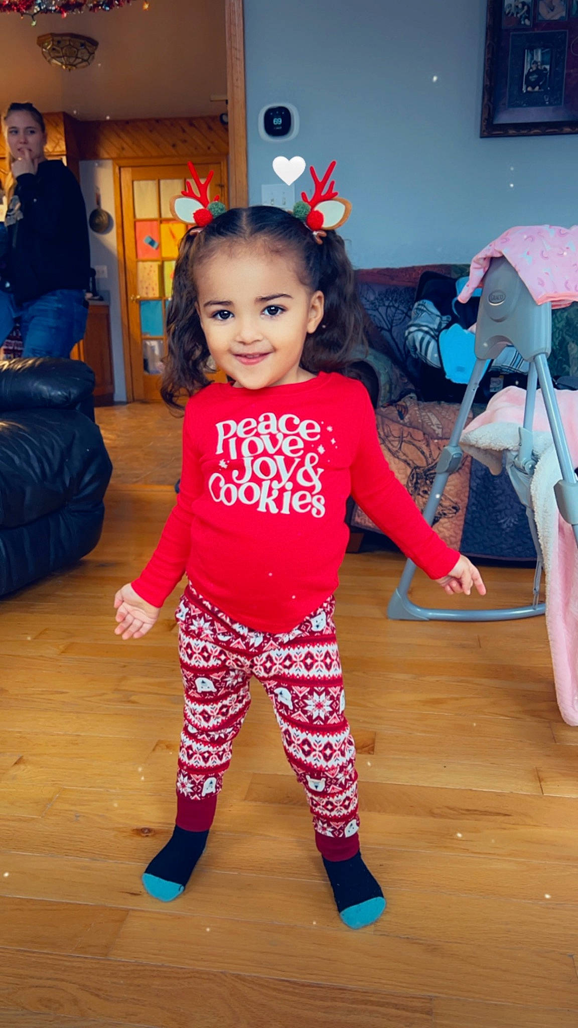 Amira is registered to the contest to win money with this photo: active_pants, baby_toddler_clothing, child, event, floor, flooring, fun, hairstyle, happy, human_leg, joint, joy, magenta, person, pink, sleeve, smile, sportswear, standing, thigh