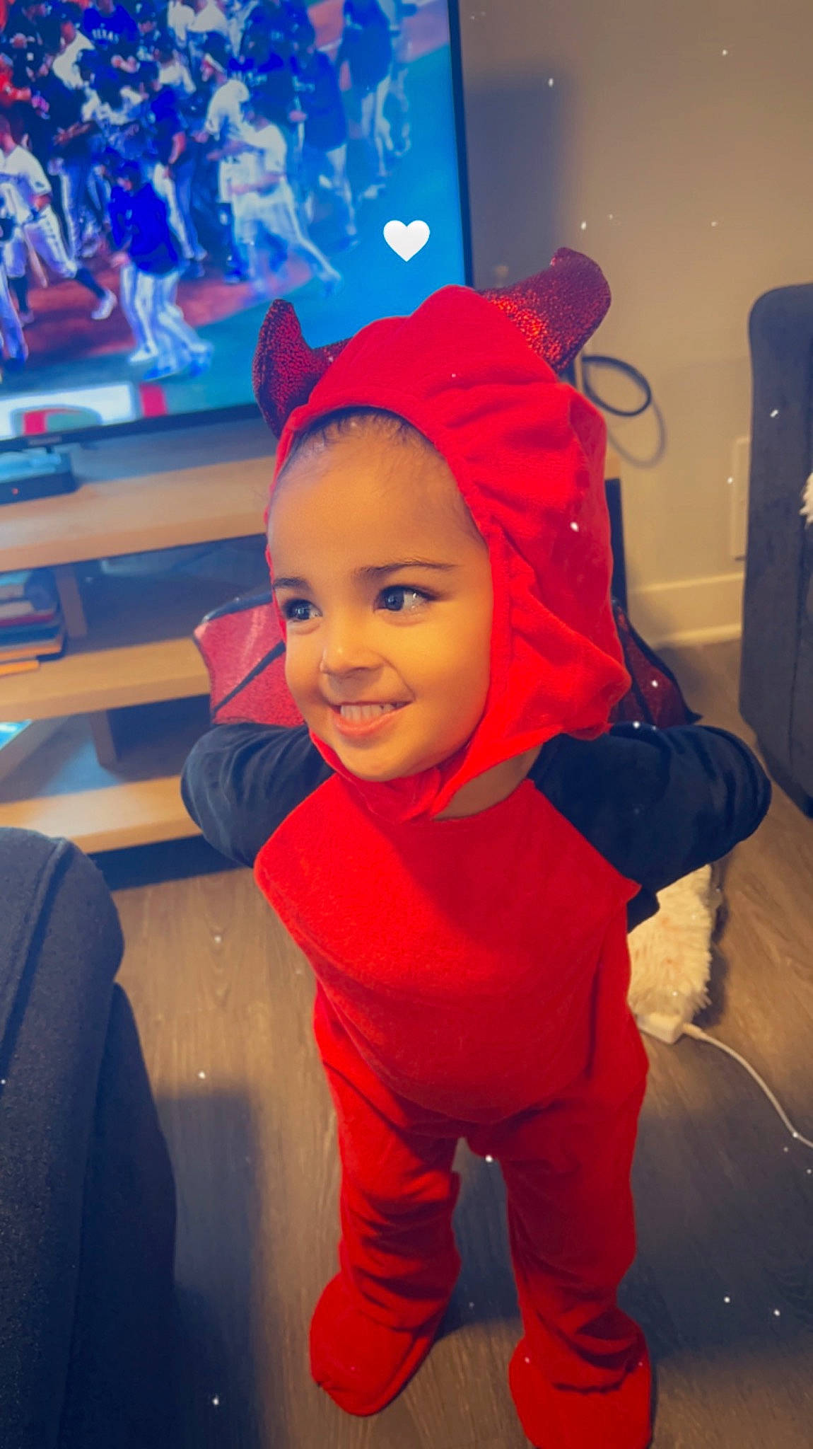 Amira is registered to the contest to win money with this photo: baby, blue, child, cloud, electric_blue, fictional_character, flooring, fun, happy, headgear, joy, leisure, magenta, person, personal_protective_equipment, play, purple, room, selfie, smile