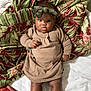 Alexandria joined the competition — help win amazing prizes! baby, child, infant, dress, headband, bow, blanket, floral_pattern, striped_pattern, lying_down, indoors, cute, adorable, skin, face, legs, hands, expression, portrait, soft_fabric