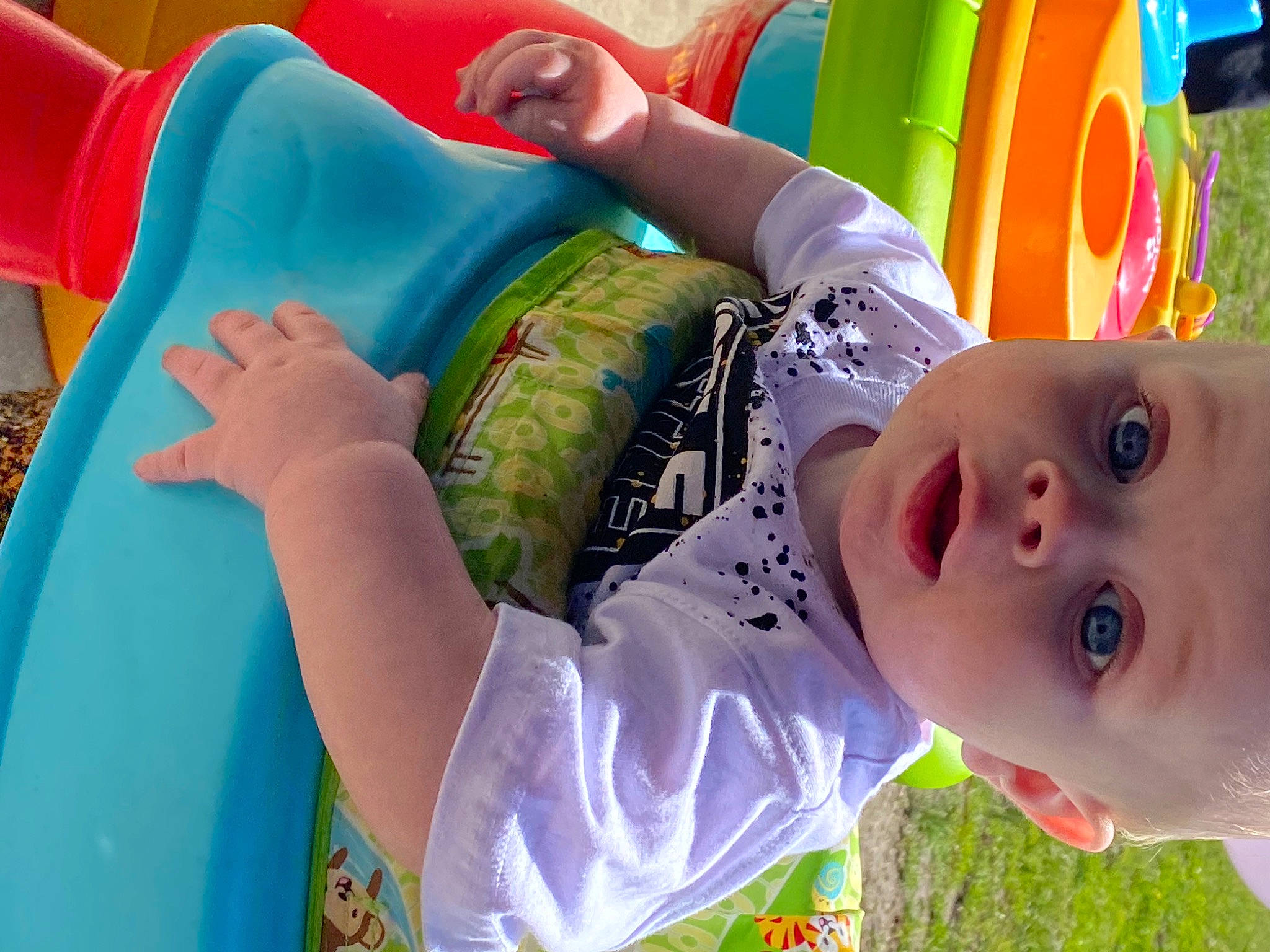 Owen is registered to the contest to win money with this photo: baby, baby_toddler_clothing, child, fun, grass, green, happy, leisure, people_in_nature, person, photograph, plant, play, public_space, recreation, smile, snapshot, summer, toddler, water