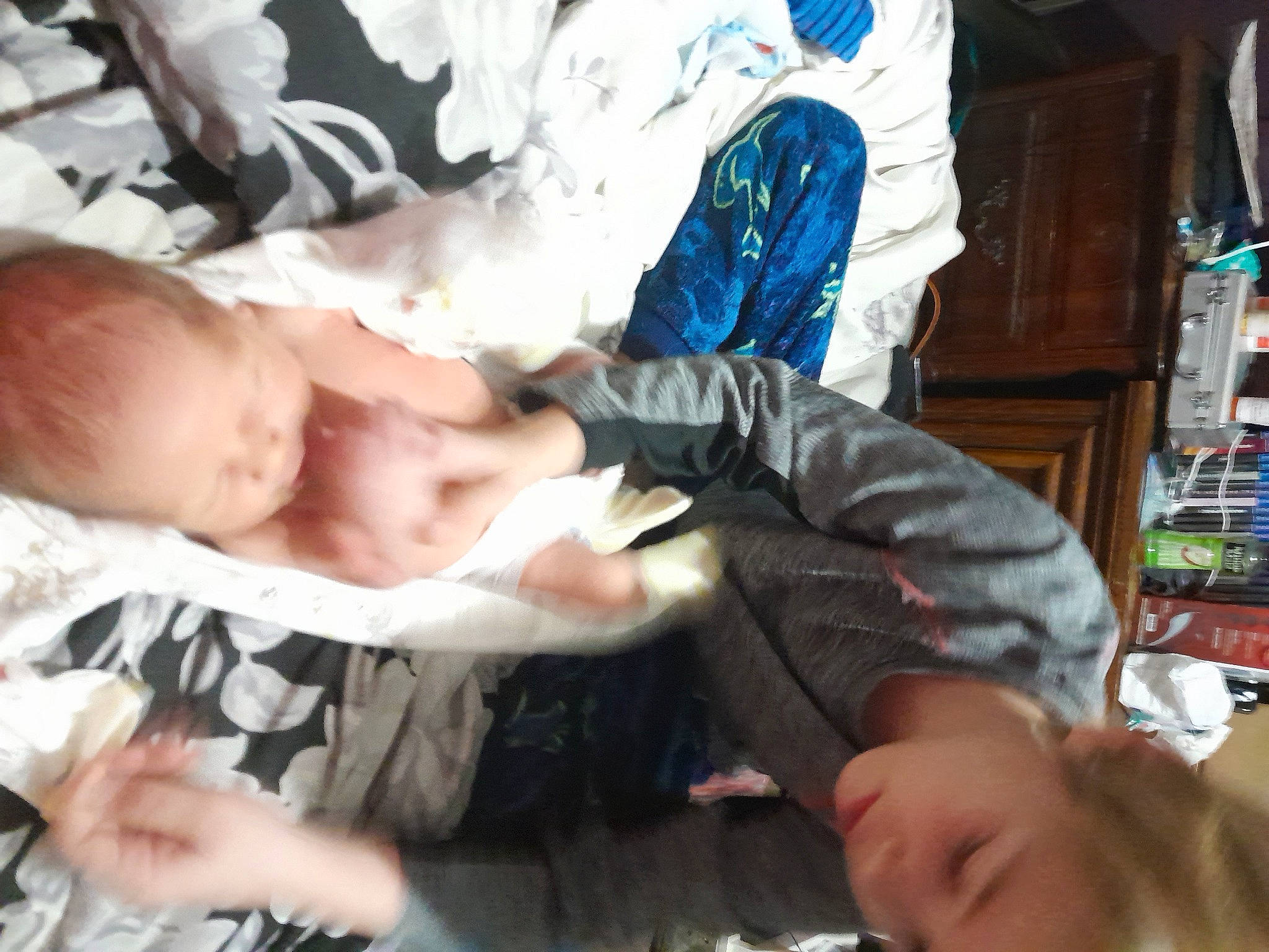 Blaine Lucas Farmer is registered to the contest to win money with this photo: baby, baby_products, baby_toddler_clothing, cheek, child, comfort, elbow, finger, fun, gesture, hand, mouth, nail, pattern, person, room, sitting, thumb, toddler, tree