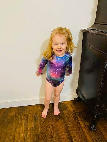 Rowan is registered to the contest to win money with this photo: baby_toddler_clothing, barefoot, blond, chair, floor, flooring, happy, hardwood, human_body, human_leg, joint, joy, knee, leg, person, shoulder, smile, sportswear, thigh, toddler