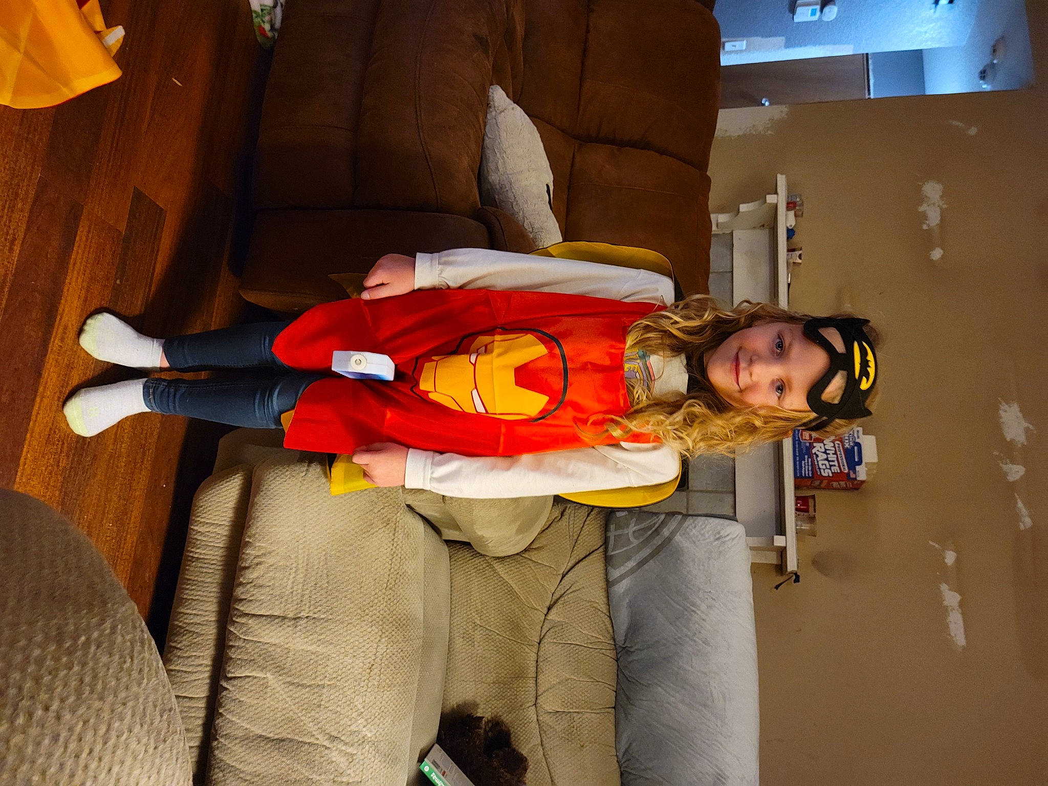 Saylor is registered to the contest to win money with this photo: carmine, comfort, costume, fictional_character, fun, glove, headwear, human_leg, joy, knee, person, personal_protective_equipment, room, wrist