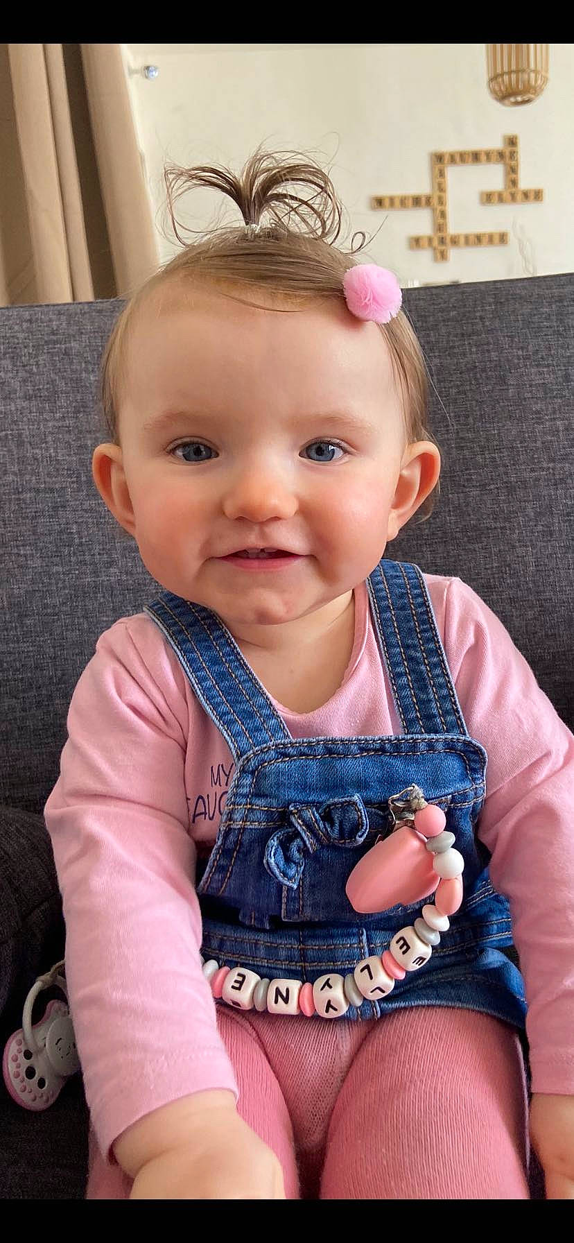 Élyne participe au concours pour gagner de l'argent avec cette photo : baby, baby_toddler_clothing, cheek, chin, clothing, dress, eye, eyelash, face, happy, head, iris, joy, lip, organ, outerwear, person, pink, product, skin