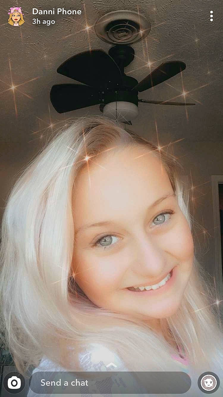 Danielle is registered to the contest to win money with this photo: black_hair, blond, ceiling_fan, close_up, dress, eyebrow, eyelash, flash_photography, hairstyle, happy, headpiece, iris, joy, layered_hair, lip, long_hair, person, petal, picture_frame, pink