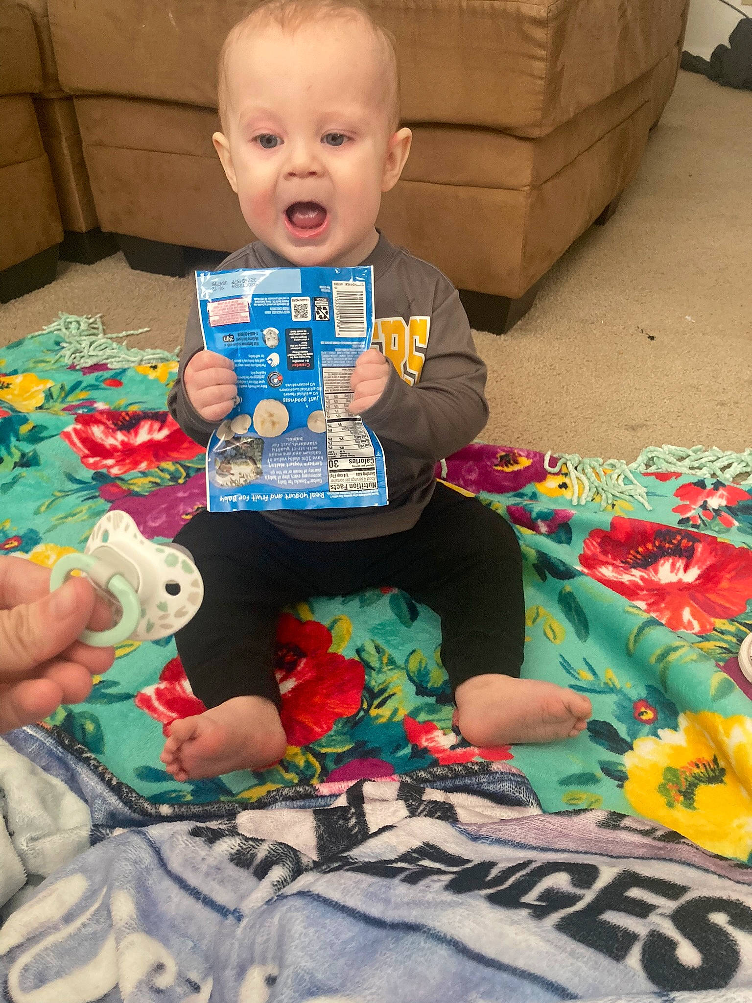 Leighton joined the competition — help win amazing prizes! baby, baby_products, baby_toddler_clothing, baby_toys, cheek, child, face, flooring, fun, happy, head, lap, pattern, people, person, play, sitting, smile, surprise, t_shirt