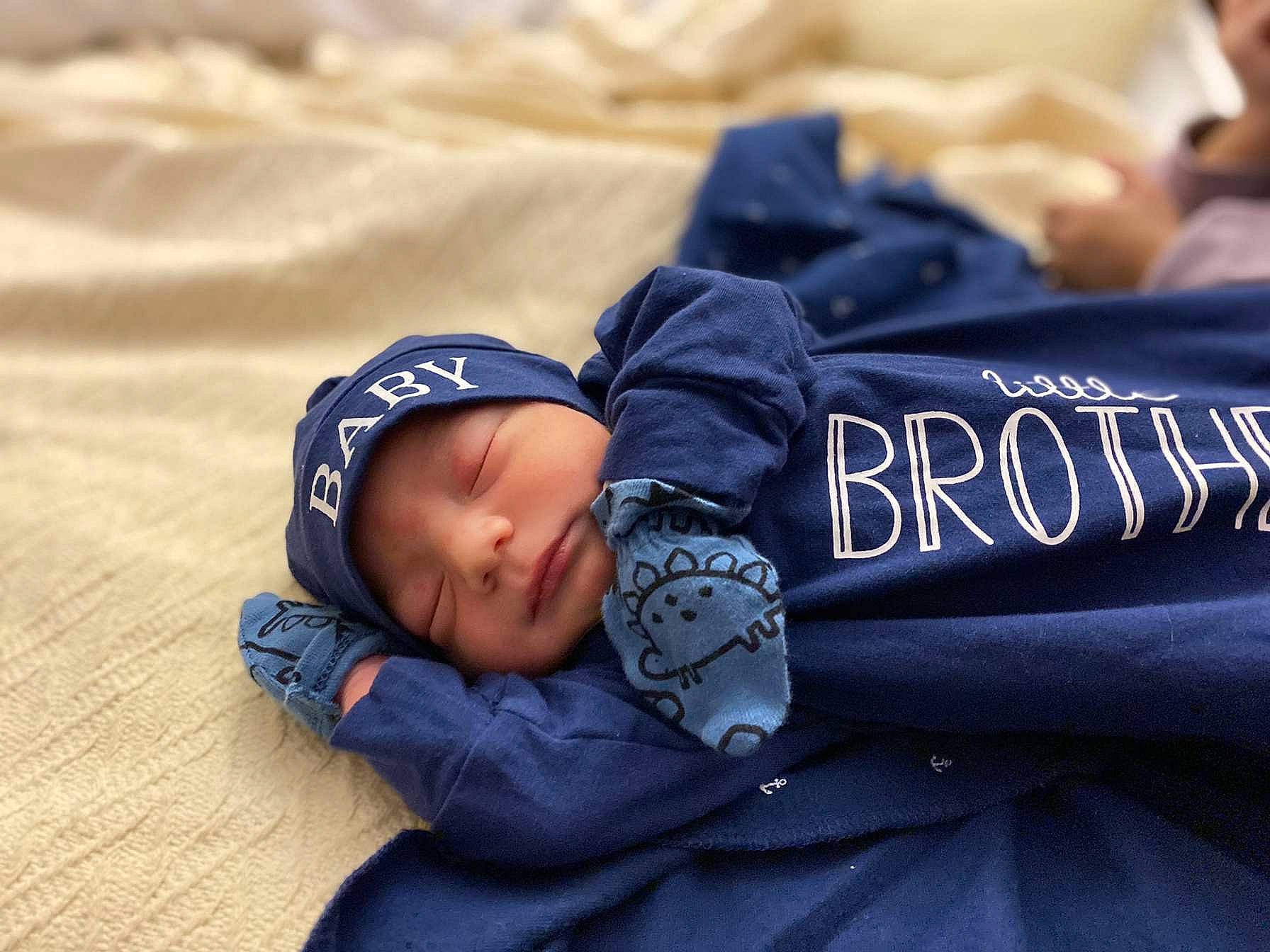 Ariel is registered to the contest to win money with this photo: baby, baby_products, baby_sleeping, baby_toddler_clothing, beanie, bedtime, cap, child, cloud, comfort, electric_blue, font, headwear, linens, nap, pattern, person, portrait_photography, sitting, sleep