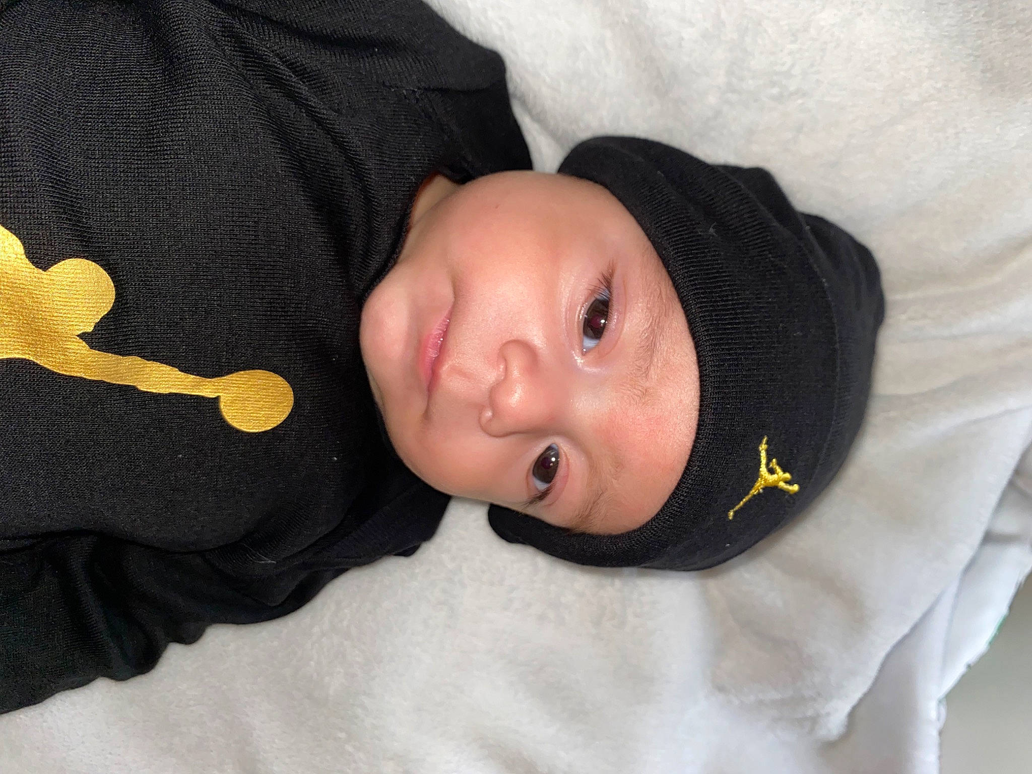 Ariel is registered to the contest to win money with this photo: baby, baby_products, baby_toddler_clothing, cheek, child, comfort, headwear, human_body, nose, person, sleeve, toddler, tree