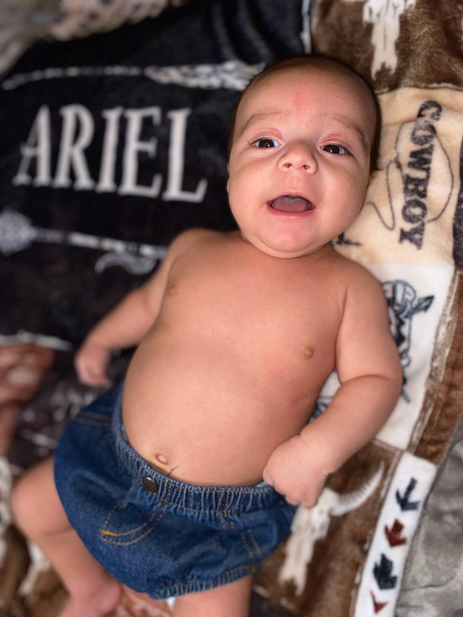Ariel is registered to the contest to win money with this photo: arm, baby, cheek, chest, cool, eye, eyelash, finger, flash_photography, hairstyle, happy, human_body, mouth, muscle, organ, person, skin, smile, stomach, toddler