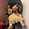 Abigail joined the competition — help win amazing prizes! baby, child, car_seat, dress, yellow_dress, golden_shoes, pacifier, indoor, wooden_floor, wall, curly_hair, infant, socks, adorable, cute, seated, clothing, footwear, person, portrait