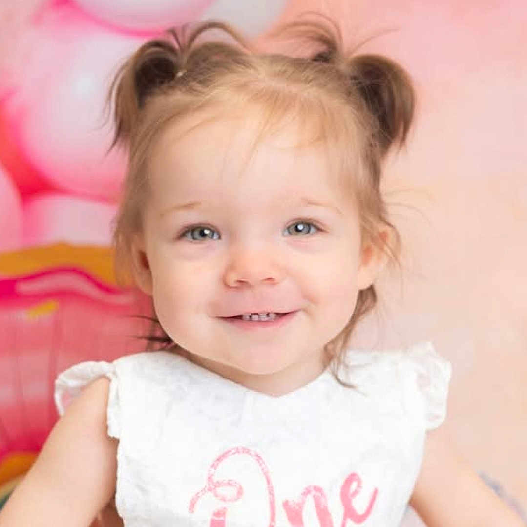 Yvie joined the competition — help win amazing prizes! balloons, birthday, celebration, child, cute, dress, face, girl, happy, headshot, indoors, one, party, person, pigtails, pink, portrait, smiling, toddler, young_child