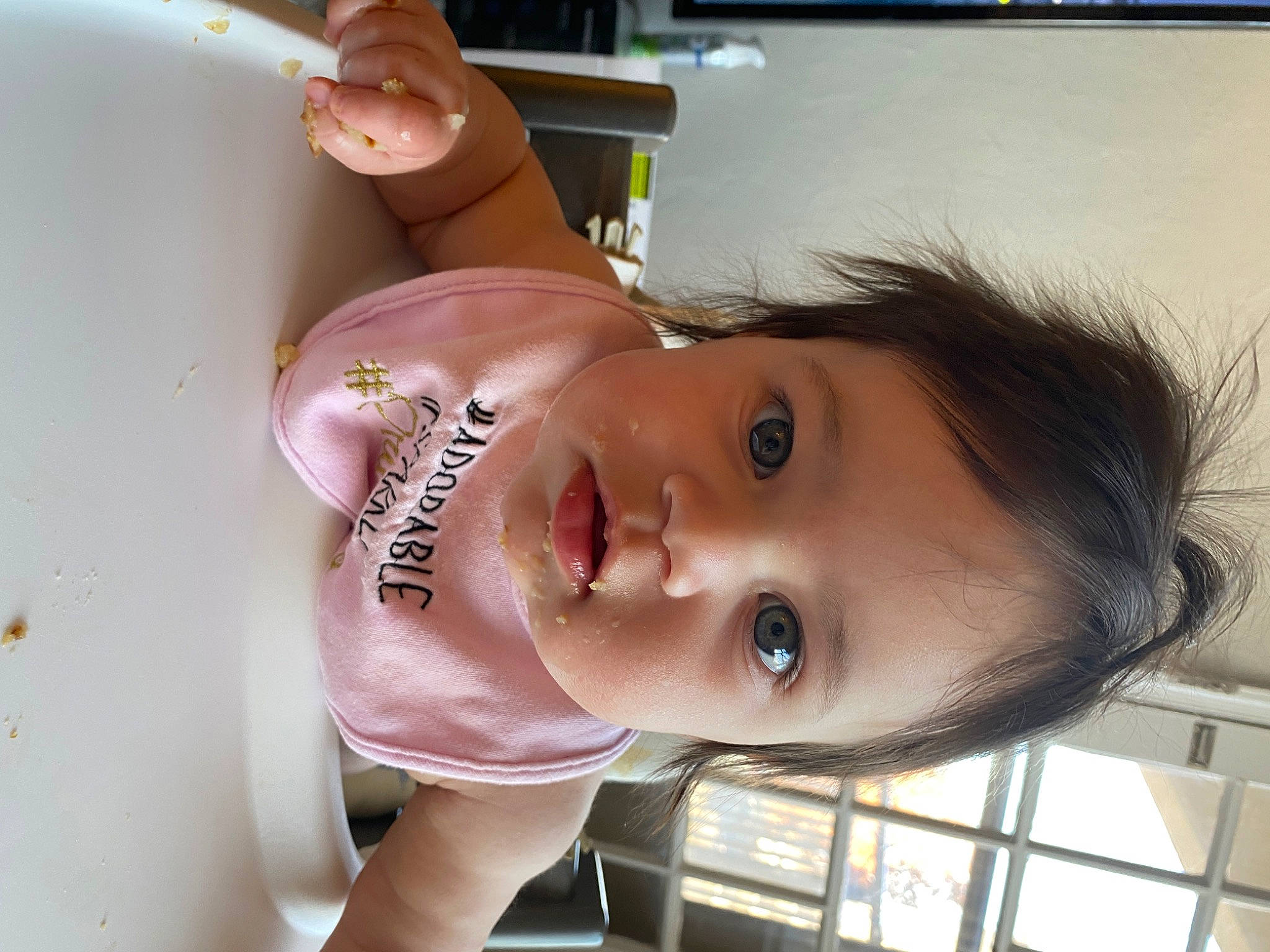 Emma is registered to the contest to win money with this photo: baby_toddler_clothing, cheek, child, eyebrow, eyelash, fun, hair, happy, iris, jaw, lip, mouth, neck, nose, person, portrait_photography, smile, toddler, window