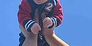 Elias joined the competition — help win amazing prizes! baby, child, sunglasses, hat, blue_sky, arms, hands, outdoor, sunny, person, clothing, jacket, playing, fun, cute, expression, lifting, casual, daytime, happy
