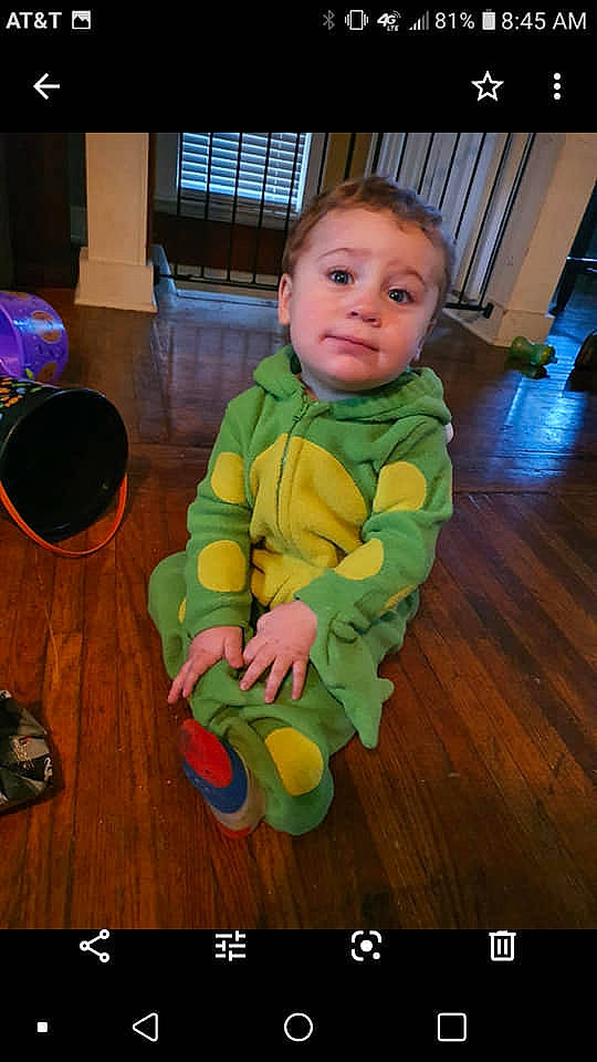 Parker is registered to the contest to win money with this photo: baby, baby_products, baby_toddler_clothing, baby_toys, child, crawling, flash_photography, floor, flooring, fun, grass, happy, hardwood, person, play, product, room, sitting, toddler, wood