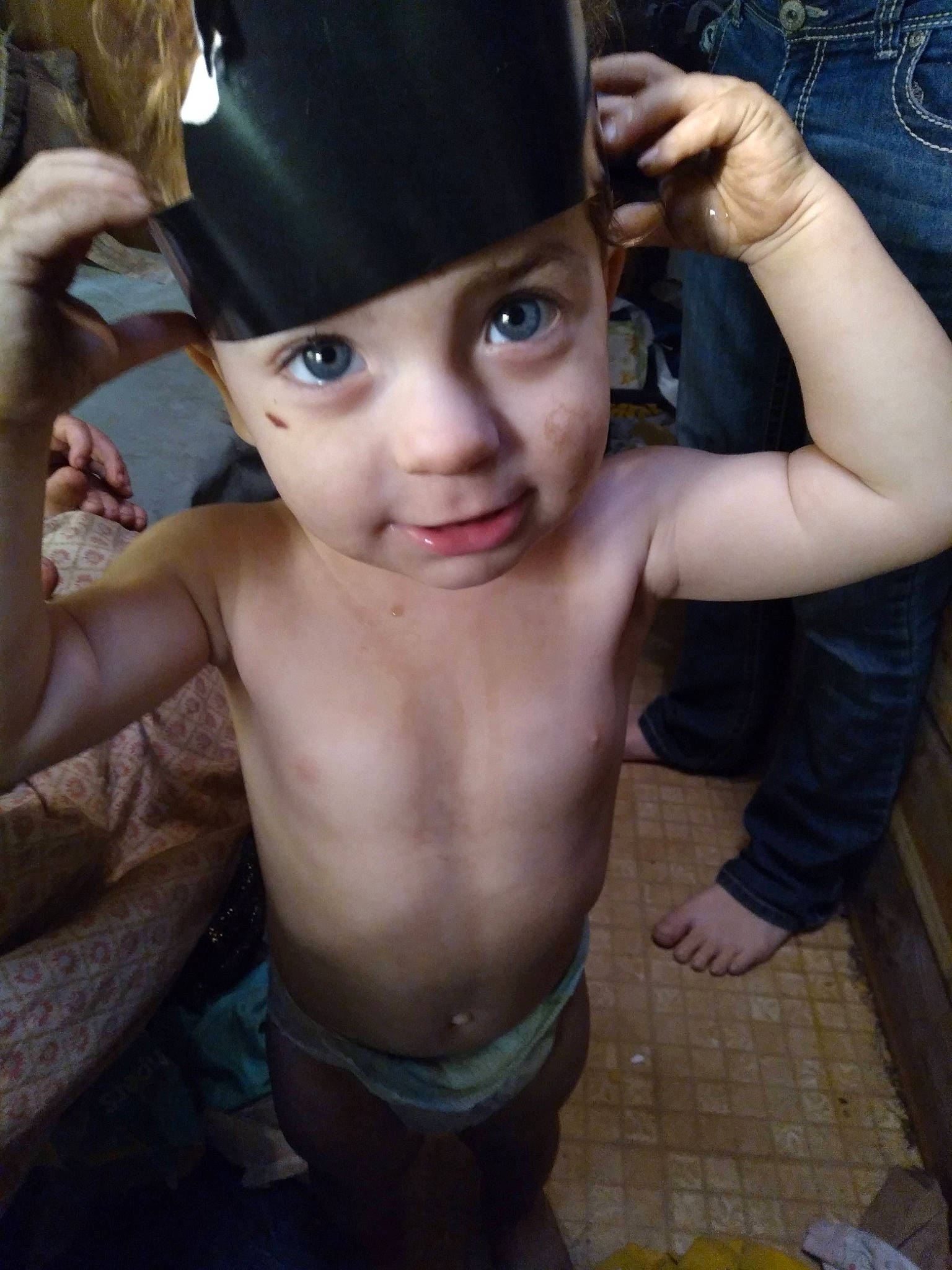 Charlie is registered to the contest to win money with this photo: cap, chest, chin, eyebrow, eyelash, finger, gesture, hand, happy, hat, headgear, headwear, helmet, jaw, lip, mouth, muscle, neck, nose, person