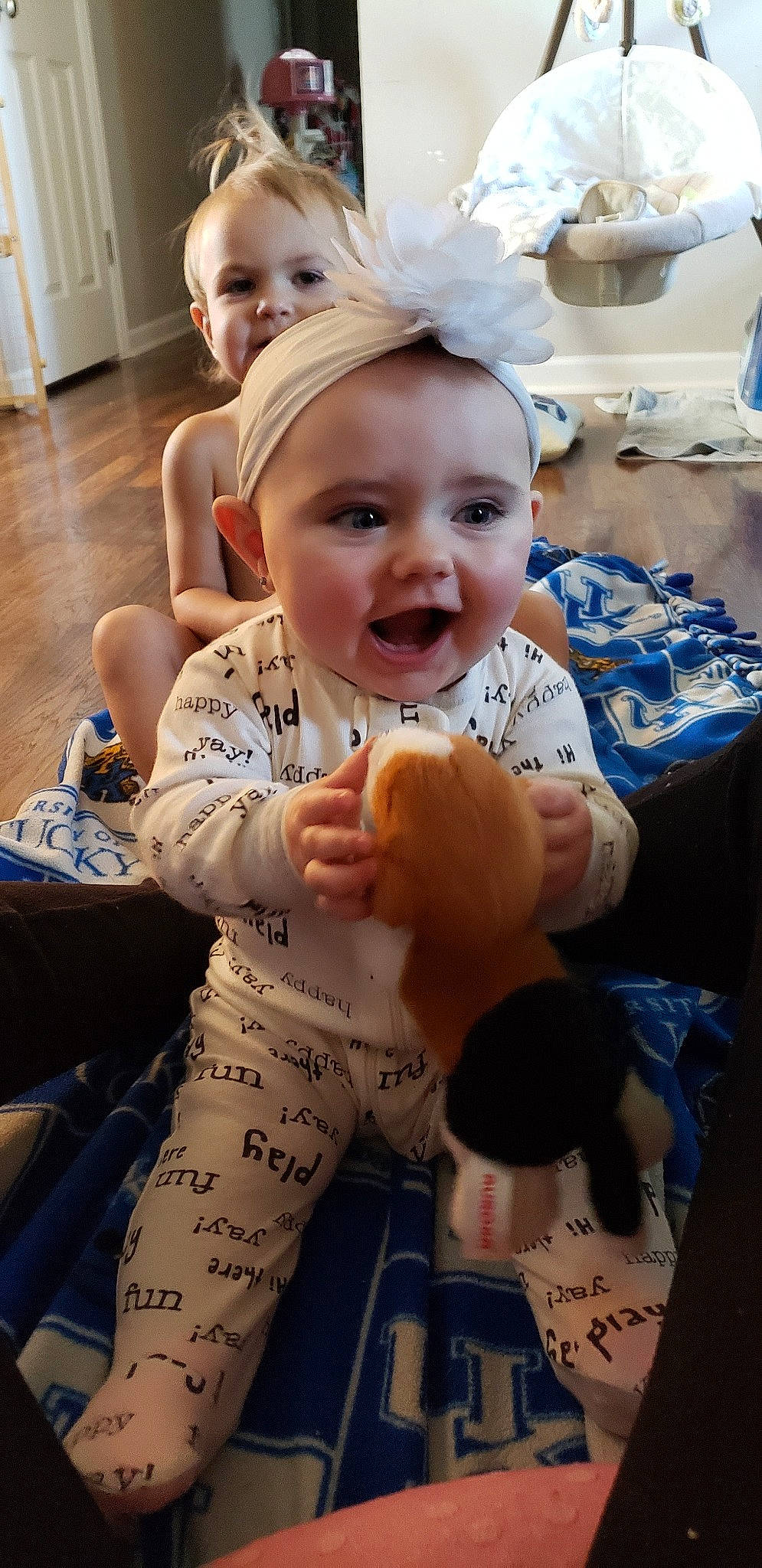 Carleigh is registered to the contest to win money with this photo: arm, baby, cheek, child, finger, leg, person, smile, tattoo, thumb, toddler