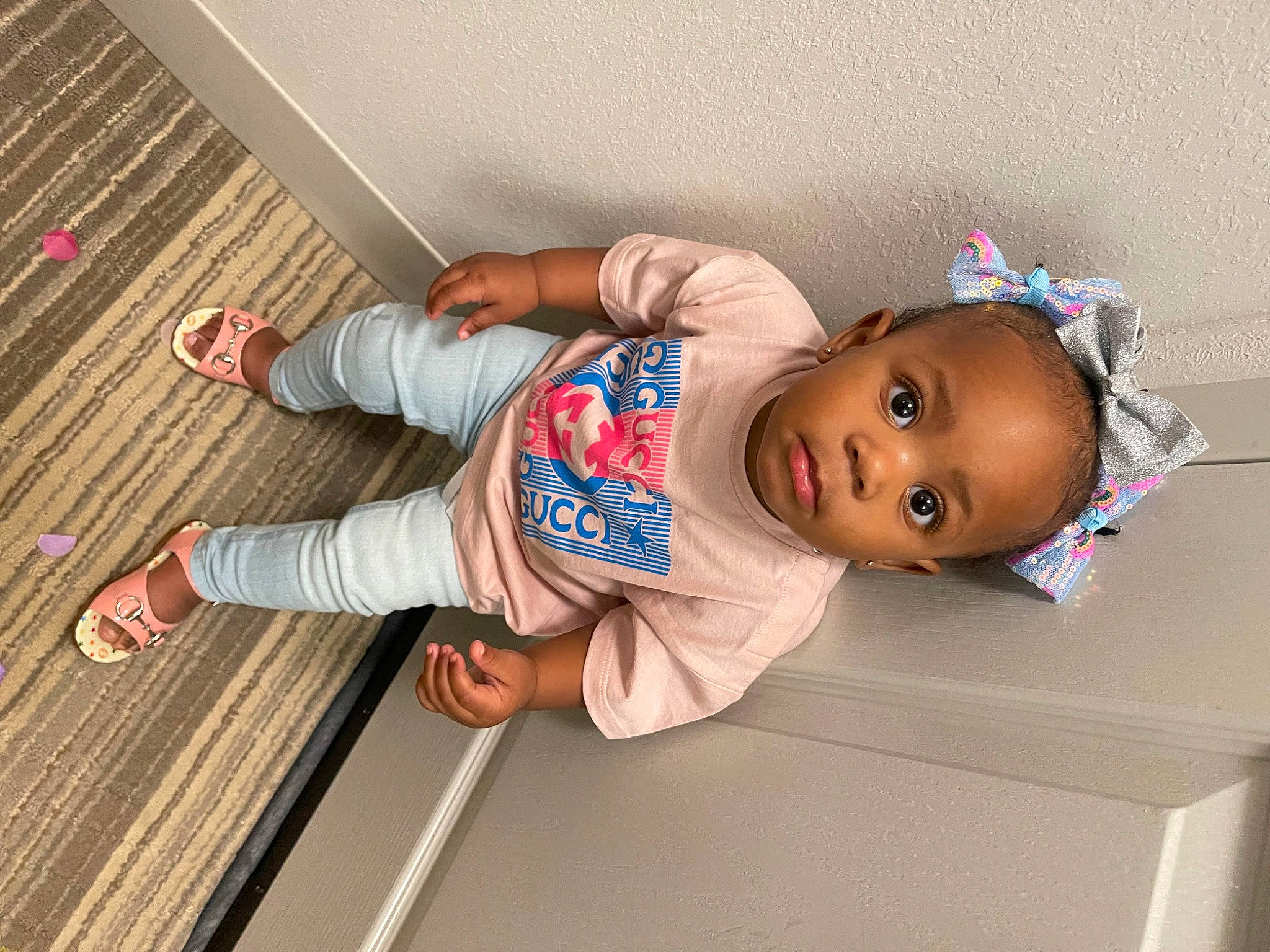 Kior is registered to the contest to win money with this photo: baby, baby_toddler_clothing, child, clothing, elbow, flooring, foot, fun, hardwood, hat, pattern, person, product, room, sleeve, sock, toddler, varnish, wood, wood_flooring