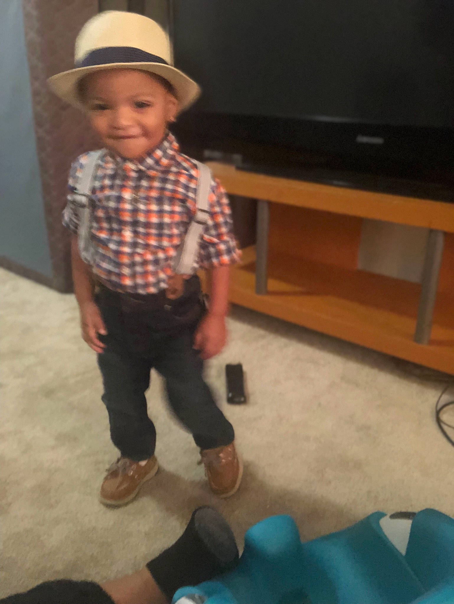 Marques joined the competition — help win amazing prizes! baby, child, cowboy_hat, design, electronic_device, fashion_accessory, fedora, footwear, fun, hat, headgear, headwear, joy, outerwear, pattern, person, plaid, play, shoe, standing