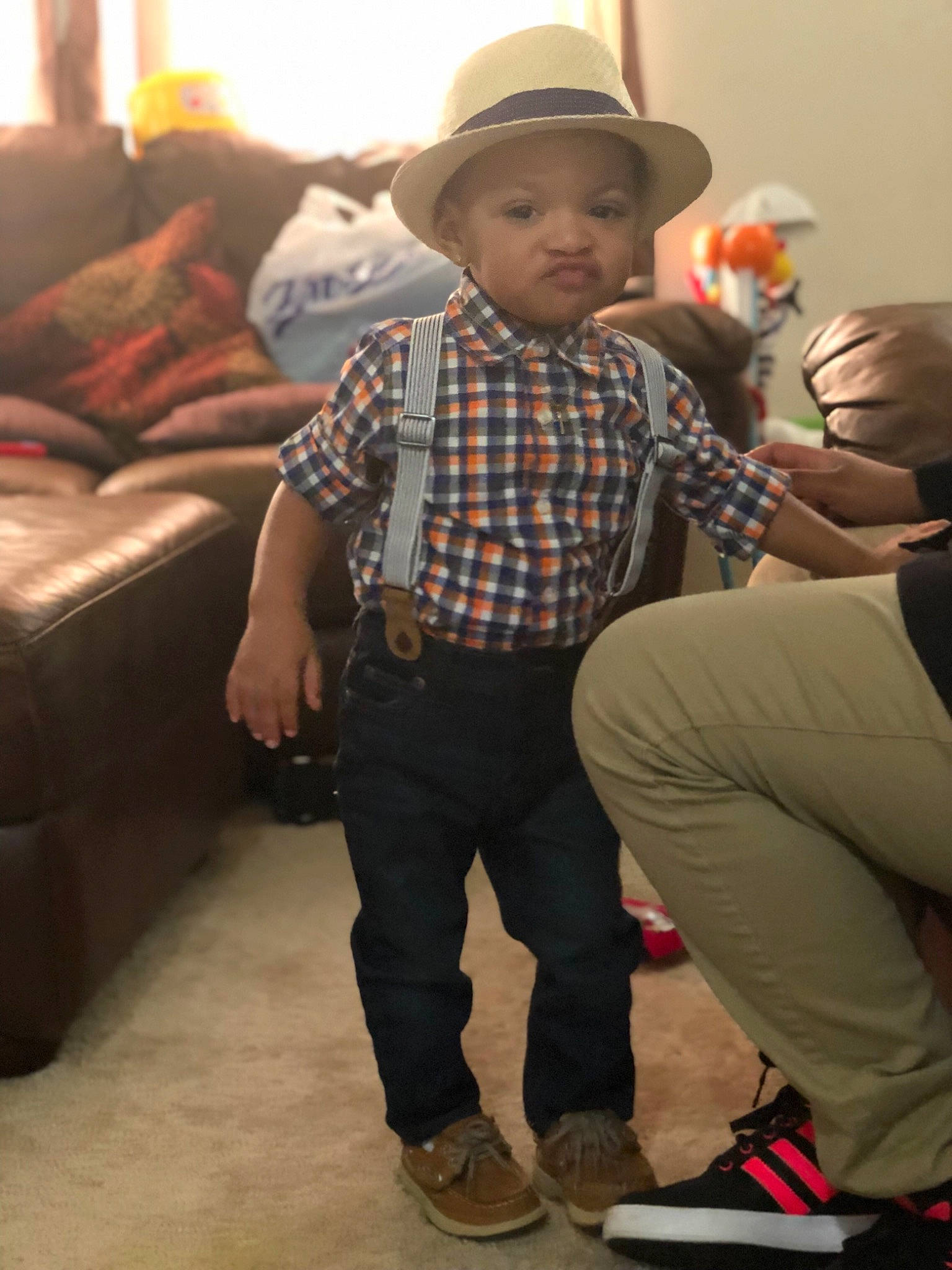 Marques is registered to the contest to win money with this photo: child, cowboy_hat, fashion_accessory, fedora, hat, headgear, jeans, outerwear, pattern, person, plaid, shoe, sun_hat, toddler, trunk