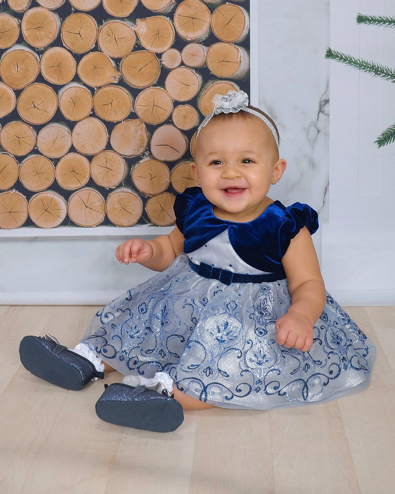 Calypso is registered to the contest to win money with this photo: blue, child, day, design, flooring, fun, girl, headgear, infant, joy, material, pattern, person, product, sitting, textile, toddler