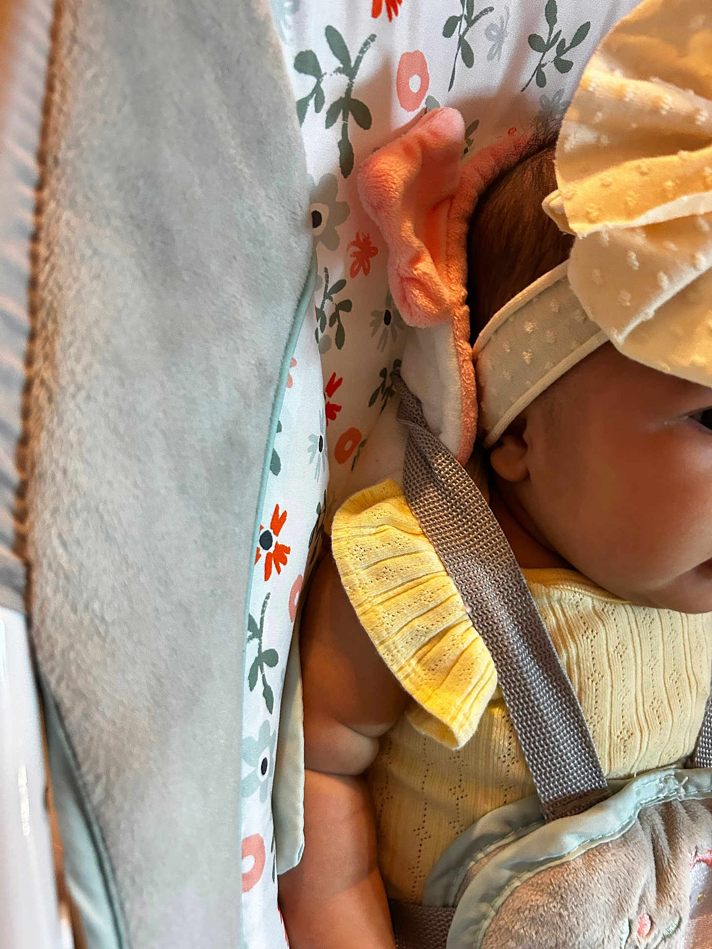 Ekna joined the competition — help win amazing prizes! baby, infant, headband, yellow_clothing, baby_seat, floral_pattern, blanket, straps, closeup, cute, child, comfort, soft_toys, indoors, portrait, baby_arm, baby_face, fabric, texture, nap_time