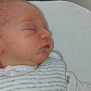 Noah participe au concours pour gagner de l'argent avec cette photo : newborn, baby, sleeping, infant, hospital, bassinet, clothing, striped, cute, face, peaceful, resting, soft, white, fabric, portrait, child, toddler, closeup, indoors