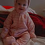 Ashlynn is registered to the contest to win money with this photo: baby, bear_ears, bed, blanket, child, cozy, cute, face, hood, indoors, infant, person, pink_onesie, portrait, red_blanket, sitting, smile, soft_lighting, warm_clothing, white_blanket