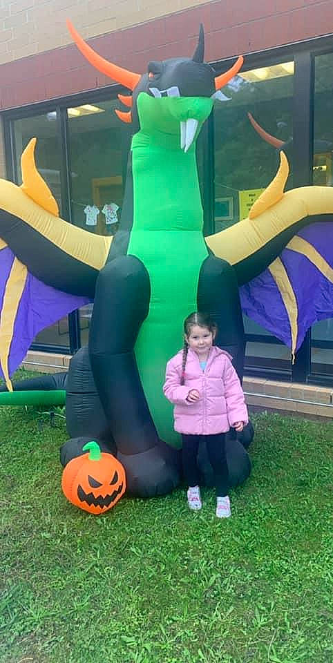 Amya is registered to the contest to win money with this photo: calabaza, games, gourd, inflatable, jack_o_lantern, joy, person, play, produce, pumpkin, trick_or_treat, vegetable